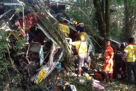 Rescuers work at the bus crash site in Chiang Mai, Thailand, on Dec. 20, 2015. A tour bus carrying 25 people crashed in northern Thailand's Chiang Mai Province on Sunday morning, killing 13 people, including 12 Malaysian tourists and one Thai tour guide, the Chinese Consulate General in Chiang Mai said. (Xinhua)