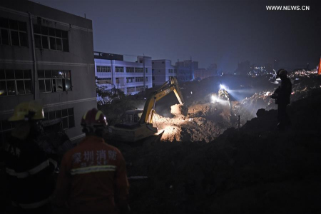 Rescuers work at the landslide site of an industrial park in Shenzhen, south China's Guangdong Province, Dec. 20, 2015. (Xinhua/Mao Siqian)