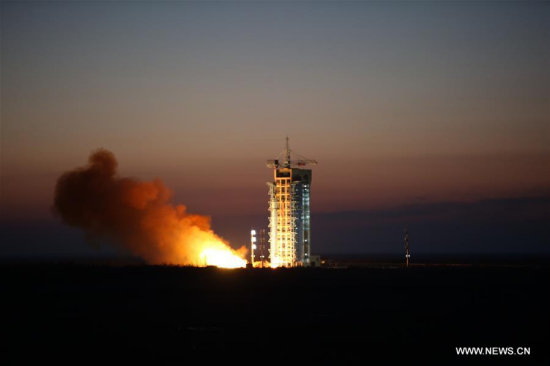 A Long March 2-D rocket carrying the Dark Matter Particle Explorer Satellite blasts off at the Jiuquan Satellite Launch Center in Jiuquan, northwest China's Gansu Province, Dec. 17, 2015. (Xinhua/Jin Liwang)