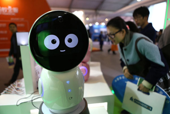 Robot Xiaoyi, which can sing, tell a story and chat with people, is on display at the Light of the Internet Expo in Wuzhen, Zhejiang province, Dec 14, 2015. (Photo: China Daily/Zou Hong)