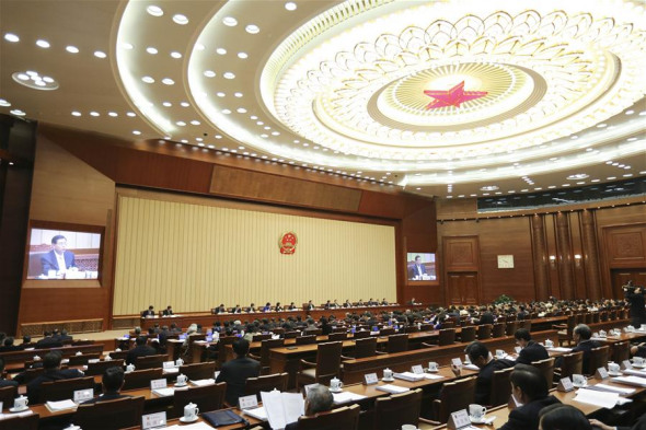 Zhang Dejiang, chairman of the Standing Committee of China's National People's Congress (NPC), presides over the closing meeting of the 18th bimonthly meeting of the National People's Congress (NPC) Standing Committee, in Beijing, capital of China, on Dec. 27, 2015. (Xinhua/Ding Lin)