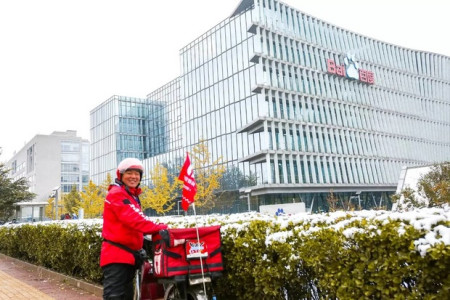 A Baidu Knight stands in front of the headquarters of Baidu in Beijing.