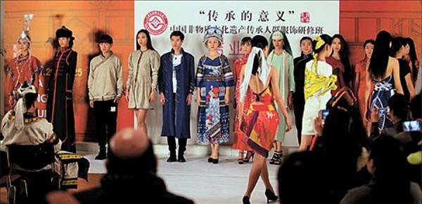 Models sport new designs that incorporate the elements of traditional ethnic group garments at a party completing a six-week program in Shanghai that helps find a way forward for garments produced by Chinas ethnic minorities.(Photo/Shanghai Daily)