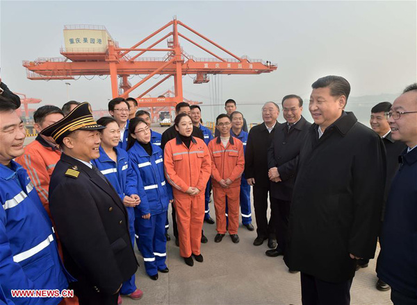Chinese President Xi Jinping (2nd R F) talks with workers during his visit to Guoyuan Port in southwest China's Chongqing Municipality, Jan. 4, 2016. Xi made an inspection tour in Chongqing from Jan. 4 to 6. (Xinhua/Li Tao)