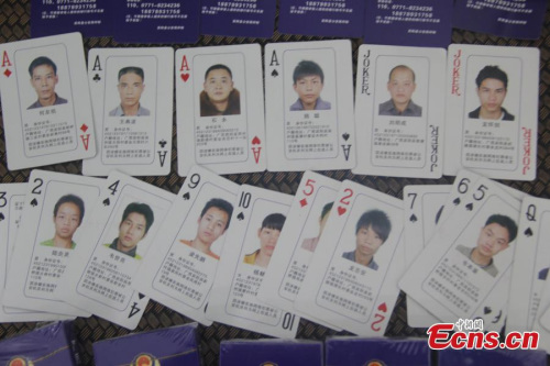 The photo shows a set of poker cards printed with head shots and other information of suspects of cybercrimes in Binyang County, Southwest Chinas Guangxi Zhuang Autonomous Region. (Photo/IC)