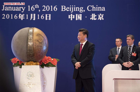 Chinese President Xi Jinping (C) unveils a symbol sculpture of the Asian Infrastructure Investment Bank (AIIB) at the opening ceremony in Beijing, capital of China, Jan. 16, 2016. The opening ceremony of AIIB launched in Beijing on Saturday. (Photo: Xinhua/Li Xueren)