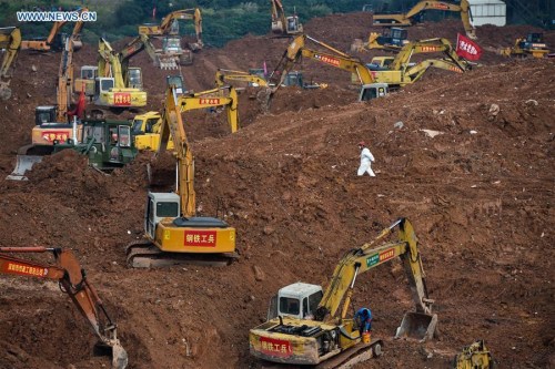 Rescuers work at the landslide site at an industrial park in Shenzhen, south China's Guangdong Province, Dec. 25, 2015. (Photo: Xinhua/Mao Siqian)