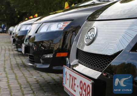 Photo taken on Oct. 15, 2014 shows the e6 taxis made by BYD, a Shenzhen based Chinese manufacturer of rechargeable batteries and automobiles, in Brussels, capital of Belgium. (Xinhua Photo)