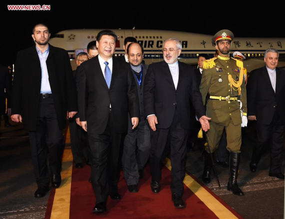 Chinese President Xi Jinping (front, L) is welcomed by Iranian Foreign Minister Mohammad Javad Zarif (front, R) in Tehran, Iran, Jan. 22, 2016. Xi Jinping arrived in Tehran Friday night for a state visit to Iran. (Photo: Xinhua/Rao Aimin)