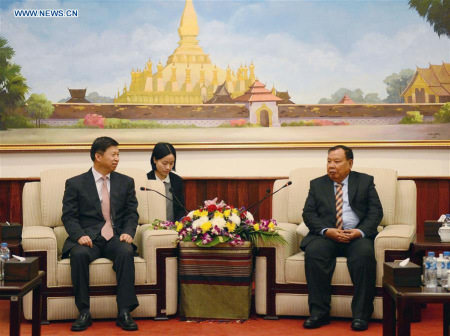 Bounnhang Vorachit, the newly-elected general secretary of the Central Committee of the Lao People's Revolutionary Party (LPRP) (R) meets with Xi Jinping's special envoy Song Tao (L) in Vientiane, Laos, Jan. 26, 2016. (Photo/Xinhua)