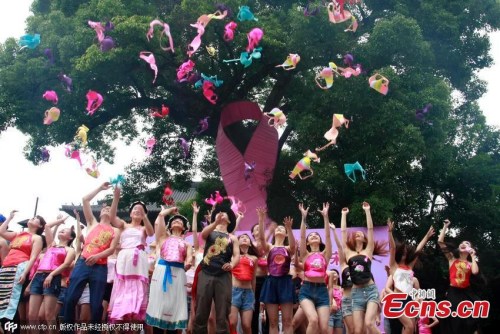 Participants throw their bras into sky to raise awareness of breast cancer in Hangzhou city, capital of East China's Zhejiang province, June 22, 2015. (Photo/CFP)