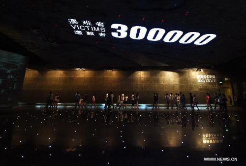 People visit the memorial hall of the victims of the Nanjing Massacre by Japanese invaders in Nanjing, capital of east China's Jiangsu Province, Aug. 15, 2015. (Photo: Xinhua/Sun Can)