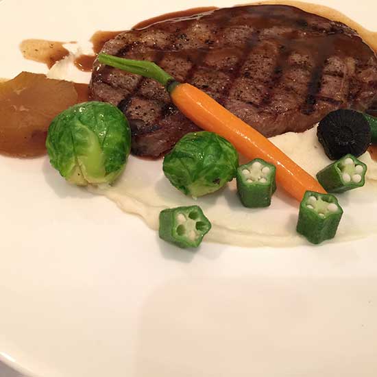 Australian beef and succulent salmon appeal to the eyes and the palates of diners at David Tao's new private dining room. (Photo: China Daily/Mike Peters)