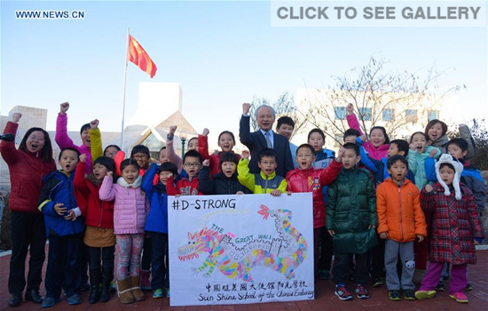 Chinese Ambassador to the United States Cui Tiankai (C) and children of Chinese diplomats send their best wishes to Dorian Murray, an American boy suffering from cancer, at Chinese Embassy in Washington D.C., capital of the United States, Jan. 14, 2016. (Photo: Xinhua/Bao Dandan)