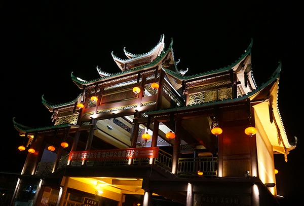 Lanterns are lit at the gate of a Dong village at the foot of Mount Fanjing, on Jan 13, 2016. (Photo by Yang Jie/chinadaily.com.cn)
