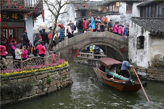 The water town of Zhouzhuang is crowded with visitors during a festival. Photos provided to China Daily