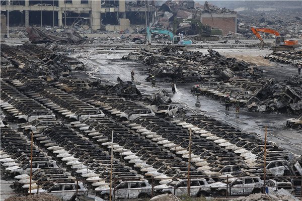 Vehicles damaged in explosions at the Port of Tianjin in August last year. Hundreds of the affected vehicles sold at auction recently.(Photo: China Daily/Chen Zhuo)