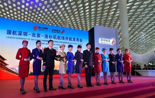 Stuff members of Air China and Shenzhen Airlines attend the launch ceremony of Air China's Shenzhen-Beijing-Los Angeles inaugural flight in Shenzhen, south China's Guangdong Province, Feb. 1, 2016. (Photo: Xinhua/Mao Siqian)