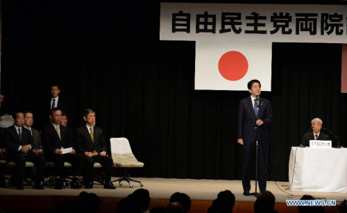 Japanese Prime Minister Shinzo Abe (2nd R) speaks at the Liberal Democratic Party (LDP) lawmakers meeting in Tokyo on Sept. 24, 2015. (Photo: Xinhua/Ma Ping) 
