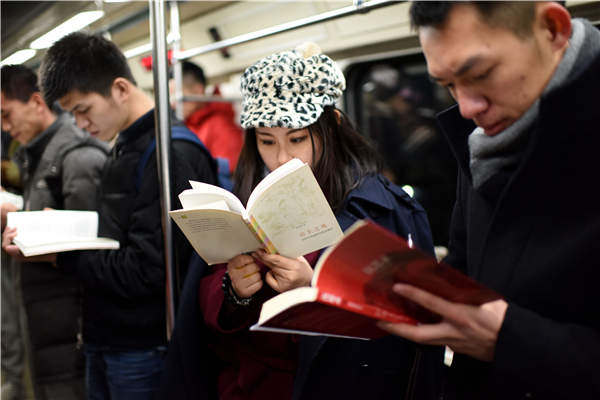 A flash-mob event in Beijing's subway aims to raise awareness of reading. Photos by He Guanxin/Provided to China Daily