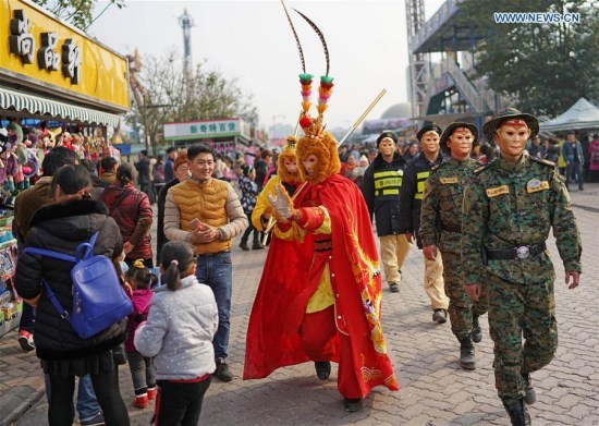 Security personnel dressed in Monkey King costume go on patrolling on a walking street as the Chinese lunar New Year, the Year of Monkey comes around the corner in southwest China's Chongqing Municipality, Feb. 2, 2016. (Photo: Xinhua/Chen Cheng)
