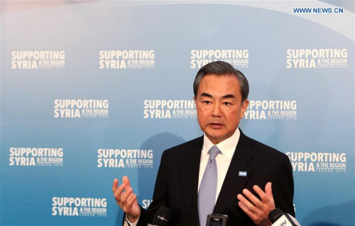 Chinese Foreign Minister Wang Yi speaks to the media after attending the Supporting Syria and the Region conference in London, Britain, Feb. 4, 2016. China will donate 10,000 tonnes of food to help ease the food shortages among Syria refugees, Wang Yi announced here Thursday. (Photo: Xinhua/Han Yan)