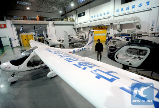 Photo taken on Dec.3, 2015 shows a RX1E electric aircraft just being assembled in Shenyang, northeast China's Liaoning Province (Photo/Xinhua)