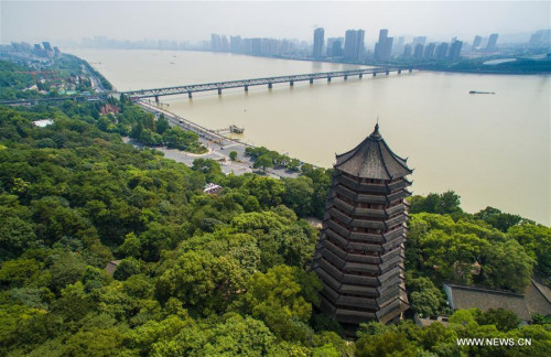 Aerial photo taken on Sept. 17, 2016 shows the Liuhe Pagoda near the Qiantang River Bridge in Hangzhou, capital of east China's Zhejiang Province. China will host the 2016 Group of Twenty (G20) summit in the eastern city of Hangzhou, best known for its scenic West Lake, on Sept. 4-5, Chinese President Xi Jinping announced in Antalya, Turkey, on Nov. 16, 2015. (Photo: Xinhua/Xu Yu)