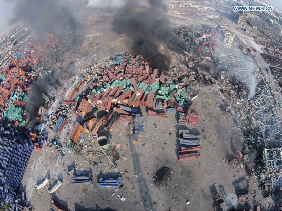 An aerial view shows the explosion site in Tianjin, north China, on Aug. 13, 2015. Fires after massive warehouse blasts in the northern Chinese port of Tianjin on Wednesday night are now under initial control. The latest death toll rose to 44, with at least 21 still missing. (Photo: Xinhua/Yue Yuewei)