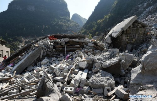 Photo taken on Feb. 8, 2016 shows the site of a landslide at Fude village in Du'an Yao Autonomous County, south China's Guangxi Zhuang Autonomous Region. Six people were killed after a landslide destroyed a two-story building in Du'an early Monday morning. According to local sources, it didn't rain when the accident happened. The cause is being investigated. (Photo: Xinhua/Lu Boan)
