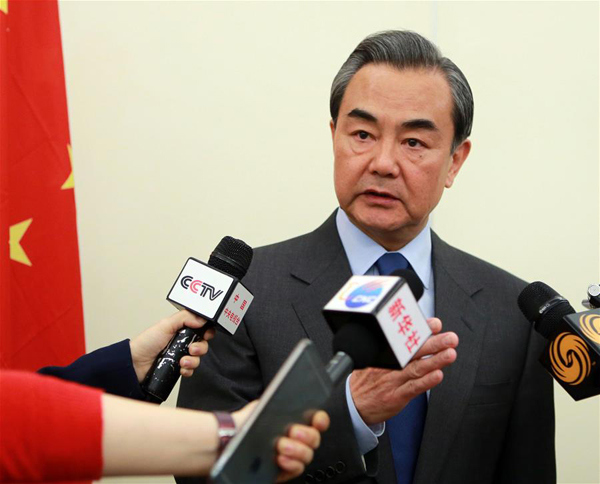 Chinese Foreign Minister Wang Yi speaks to Chinese media after the fourth foreign ministers' meeting of the International Syria Support Group in Munich, Germany, Feb. 12, 2016. Chinese Foreign Minister Wang Yi said here on Friday that the Munich meeting on Syria had achieved hard-won results, and all sides involved should make efforts to get the newly-reached agreement implemented. (Xinhua/Luo Huanhuan)