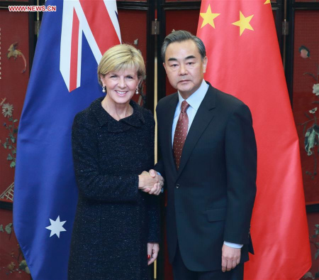 Chinese Foreign Minister Wang Yi (R) shakes hands with his Australian counterpart Julie Bishop in Beijing, capital of China, Feb. 17, 2016. Wang and Bishop attended the third round of bilateral diplomatic and strategic dialogue in Beijing on Wednesday. (Photo: Xinhua/Ding Haitao)