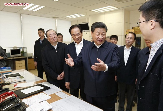 Chinese President Xi Jinping (2nd R, front) talks with a correspondent who is just back from a reporting in Zhengding County of Hebei Province, at the headquarters of Xinhua News Agency in Beijing, capital of China, on Feb. 19, 2016. Xi on Friday visited the People's Daily, Xinhua News Agency and China Central Television, the nation's three leading news providers. (Xinhua/Ju Peng)