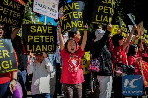 eople take part in a rally in support of New York City police officer Peter Liang, in Los Angeles, the United States, Feb. 20, 2016. (Xinhua/Zhang Chaoqun)