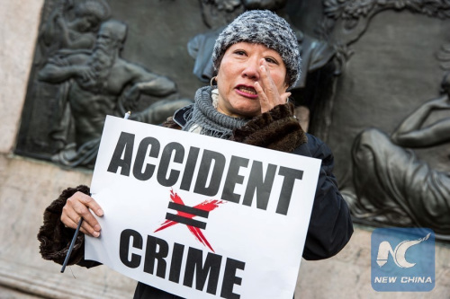 A woman in tears speaks to the press during a rally in support of New York City Police officer Peter Liang, at Brooklyn's Cadman Plaza Park, in New York, the United States, Feb. 20, 2016. (Xinhua/Li Muzi)