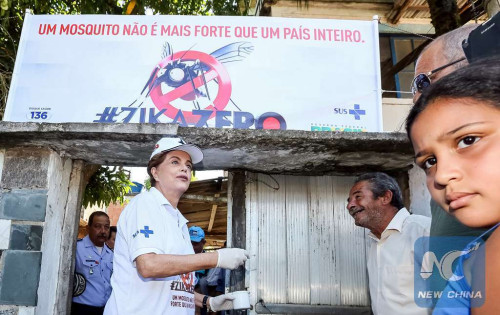 Image provided by Brazil's Presidency shows Brazilian President, Dilma Rousseff (L-Front), talking with residents of the Zepelin Community, in the framework of Zika Zero National Mobilization Day, in Rio de Janeiro, Brazil, on Feb. 13, 2016. (Xinhua/Roberto Stuckert Filho/Brazil's Presidency)