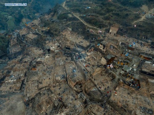 The Wenquan Village after a fire is seen in Jianhe County, Qiandongnan Miao and Dong Autonomous Prefecture of southwest China's Guizhou Province, Feb. 21, 2016. A fire broke out Saturday evening in the village, affecting 120 people and damaging more than 60 houses. (Photo: Xinhua/Ou Dongqu)