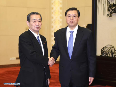 Zhang Dejiang (R), chairman of the Standing Committee of China's National People's Congress (NPC), meets with a Japanese delegation who are here to attend a bilateral mechanism for regular exchanges, in Beijing, capital of China, Feb. 22, 2016. (Photo: Xinhua/Xie Huanchi)