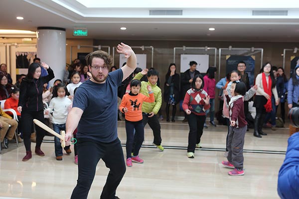 Actors from Urban Aphrodite International, a private theater company in Shanghai, host a workshop to help youngsters better understand Shakespeare's plays. (Photo provided to China Daily)