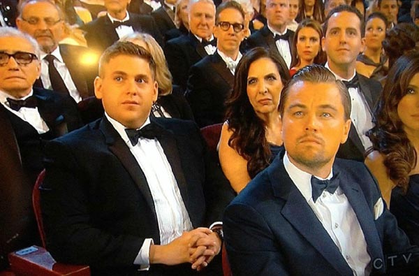 Leonardo DiCaprio (right, front) reacts as the Best Actor award is announced at 86th Acaademy Awards. (Photo/CRIonline)