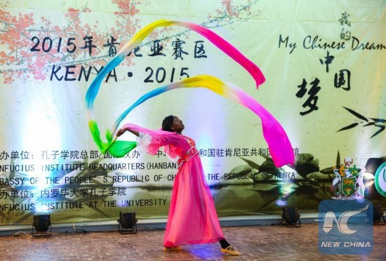 A student performs Chinese dance during the 14th "Chinese Bridge" language proficiency competition held in Nairobi on May 18, 2015. The competition was organized by the Chinese Embassy in Kenya and the University of Nairobi's Confucius Institute. The champion will attend the final competition held in China on behalf of Kenyan university students in July. (Photo: Xinhua/Pan Siwei)