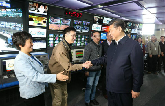 Chinese President Xi Jinping (R, front) shakes hands with staff members at the control room of China Central Television (CCTV) in Beijing, capital of China, on Feb. 19, 2016. Xi on Friday visited the People's Daily, Xinhua News Agency and CCTV, the nation's three leading news providers. (Xinhua/Ma Zhancheng)