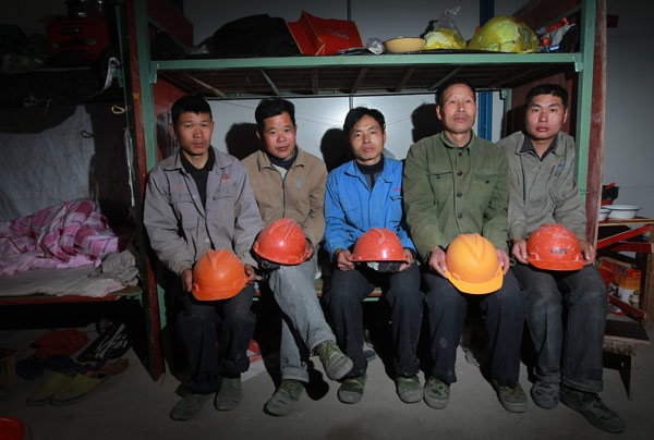 A group of migrant workers in their temporary dorm at a construction site in the Pudong district of Shanghai in May. (Photo/Xinhua)