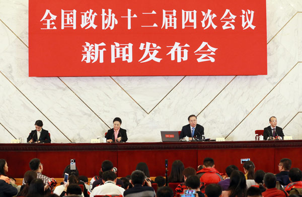 Wang Guoqing answers questions from journalists at a news briefing for CPPCC annual session in Beijing on Wednesday. (Photo by Zou Hong/China Daily)