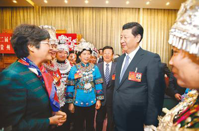 Chinese President Xi Jinping (C), also general secretary of the Communist Party of China (CPC) Central Committee and chairman of the Central Military Commission, joins the panel discussion with National People's Congress (NPC) deputies from Guizhou province during the second session of the 12th NPC, in Beijing, March 7, 2014. (Photo/People's Daily Online)  