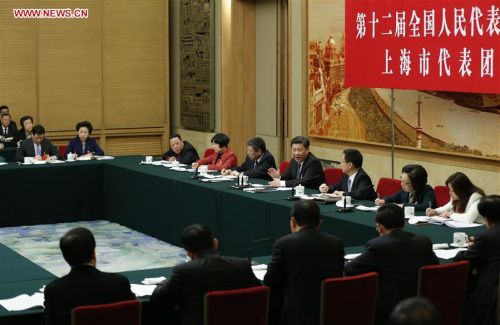 Chinese President Xi Jinping joins a group deliberation of deputies from Shanghai to the annual session of the National People's Congress in Beijing, capital of China, March 5, 2016. (Photo: Xinhua/Ju Peng)