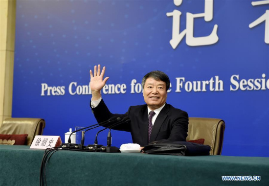 Xu Shaoshi, minister in charge of the National Development and Reform Commission, gestures during a press conference for the fourth session of China's 12th National People's Congress (NPC) on the country's economic and social development and the draft outline of the 13th Five-Year Plan in Beijing, capital of China, March 6, 2016. (Photo: Xinhua/Chen Yichen)