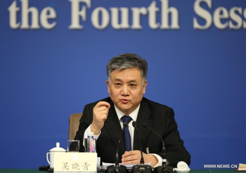 Wu Xiaoqing, a member of the 12th National Committee of the Chinese People's Political Consultative Conference (CPPCC), answers questions at a press conference on green development during the annual session of national advisory body in Beijing, capital of China, March 7, 2016. (Photo: Xinhua/Jin Liwang)