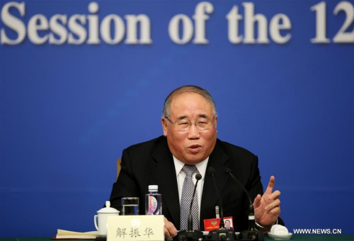 Xie Zhenhua, a member of the 12th National Committee of the Chinese People's Political Consultative Conference (CPPCC), answers questions at a press conference on green development during the annual session of national advisory body in Beijing, capital of China, March 7, 2016. (Photo: Xinhua/Jin Liwang)