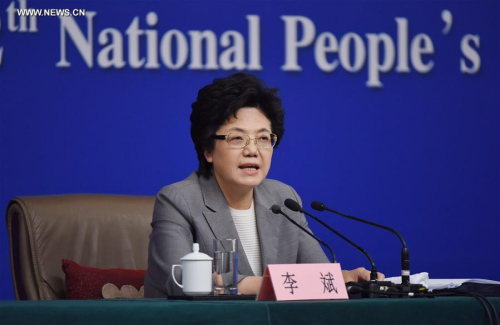 Li Bin, minister in charge of the National Health and Family Planning Commission, answers questions at a press conference on China's two-child policy on the sidelines of the fourth session of China's 12th National People's Congress in Beijing, capital of China, March 8, 2016. (Photo: Xinhua/Xue Yubin)